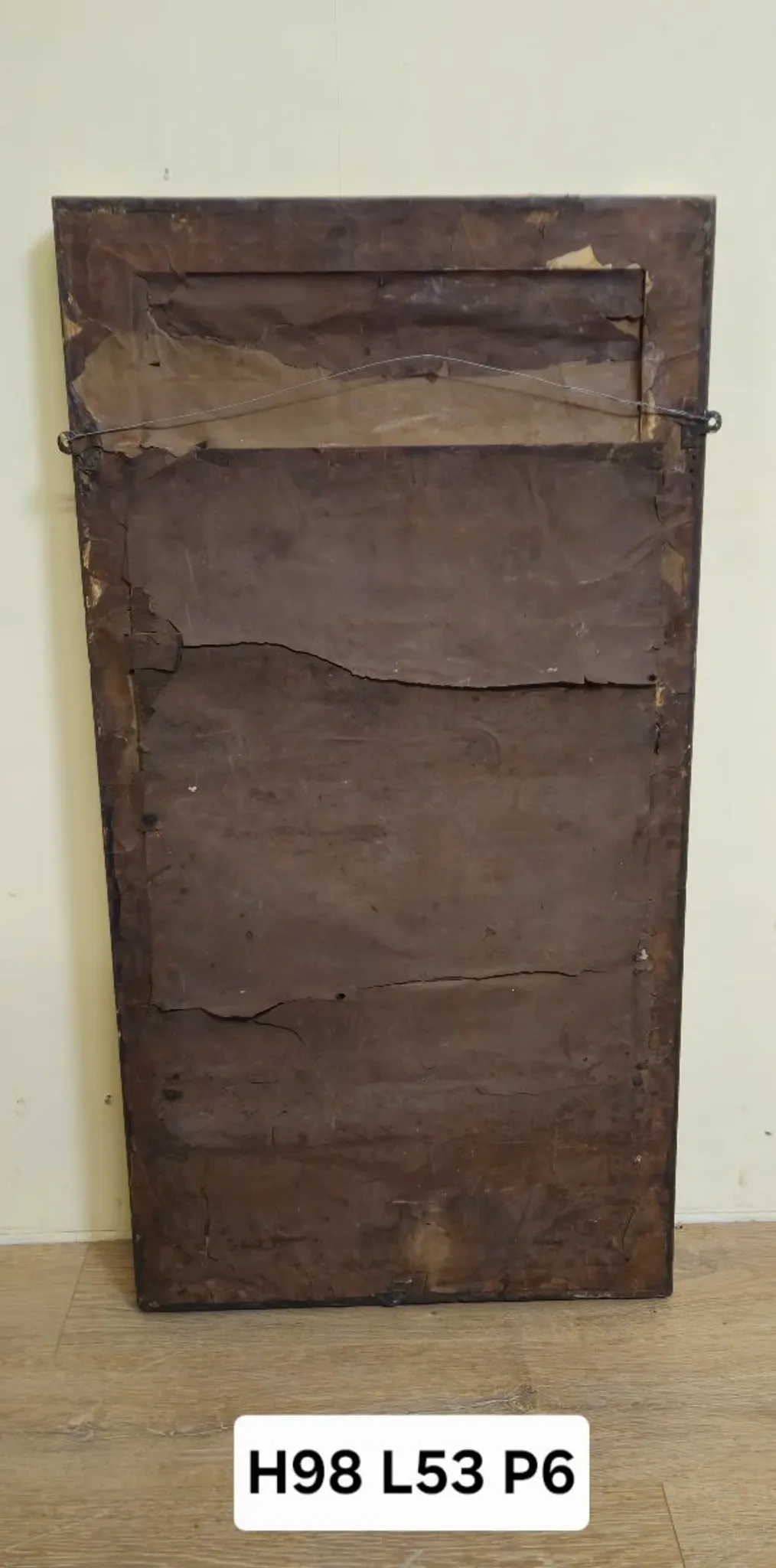 Large antique gilded wooden mirror with terracotta relief from the Empire period.
