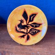 Terracotta plate, Jean Lurçat decorated with a rooster and foliage.