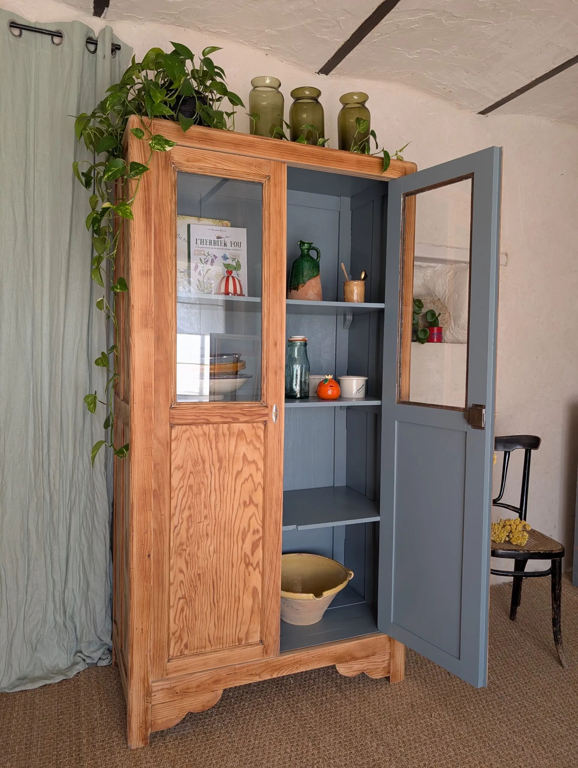 Old glass-fronted wooden library – blue interior