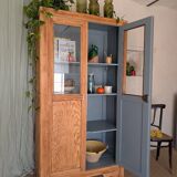 Old glass-fronted wooden library – blue interior