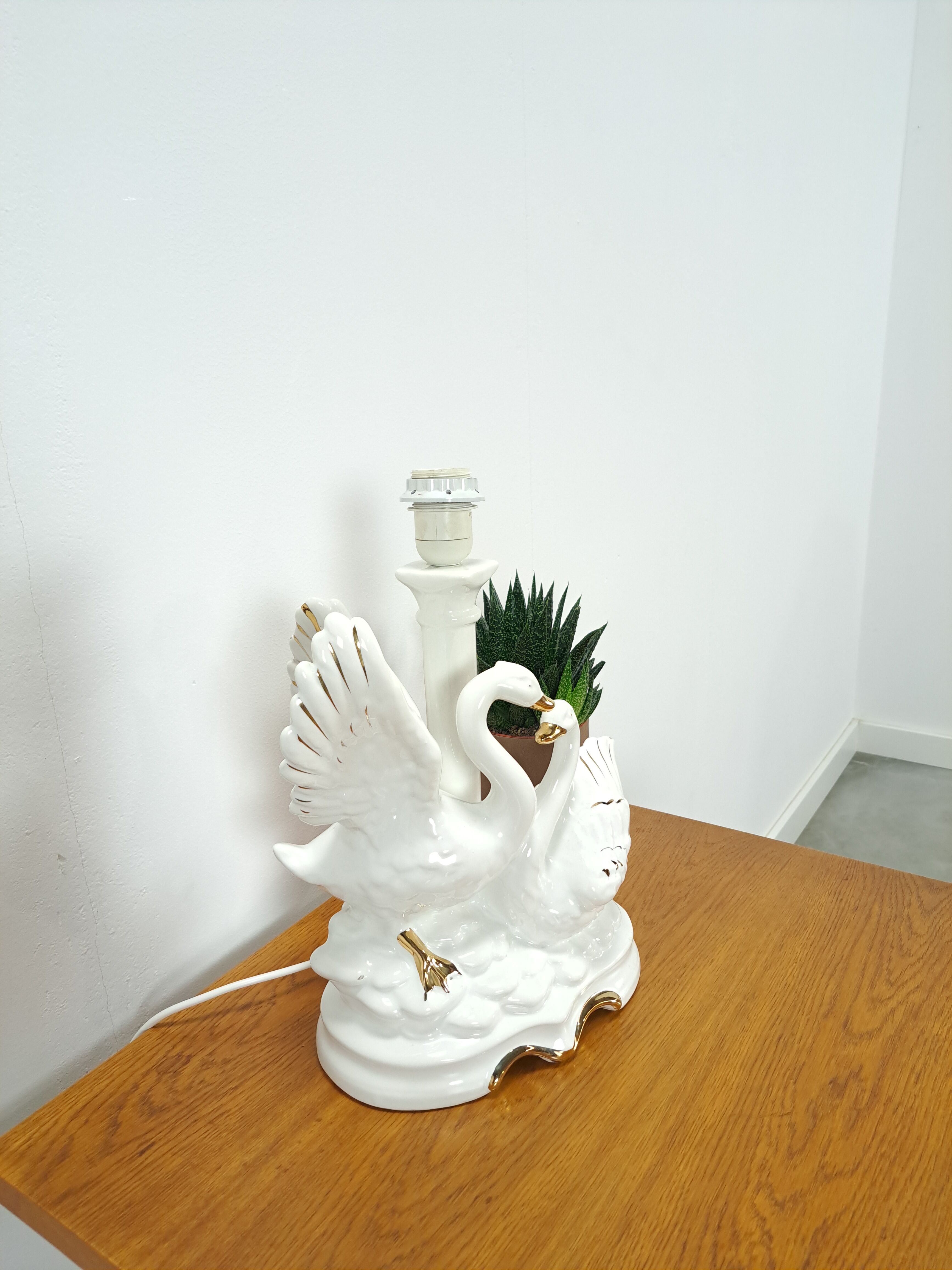 Porcelain lamp swans with vintage gold details