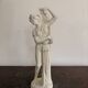 Sculpture of a bathing nymph in neoclassical style, made of plaster.