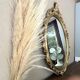 Oval mirror in Baroque style