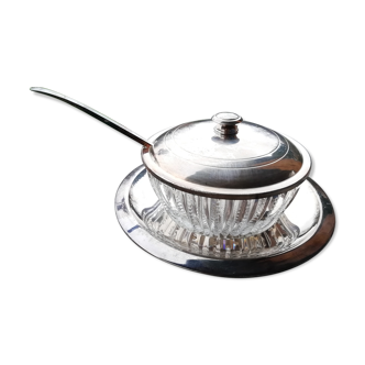 Glass cup on silver metal plate