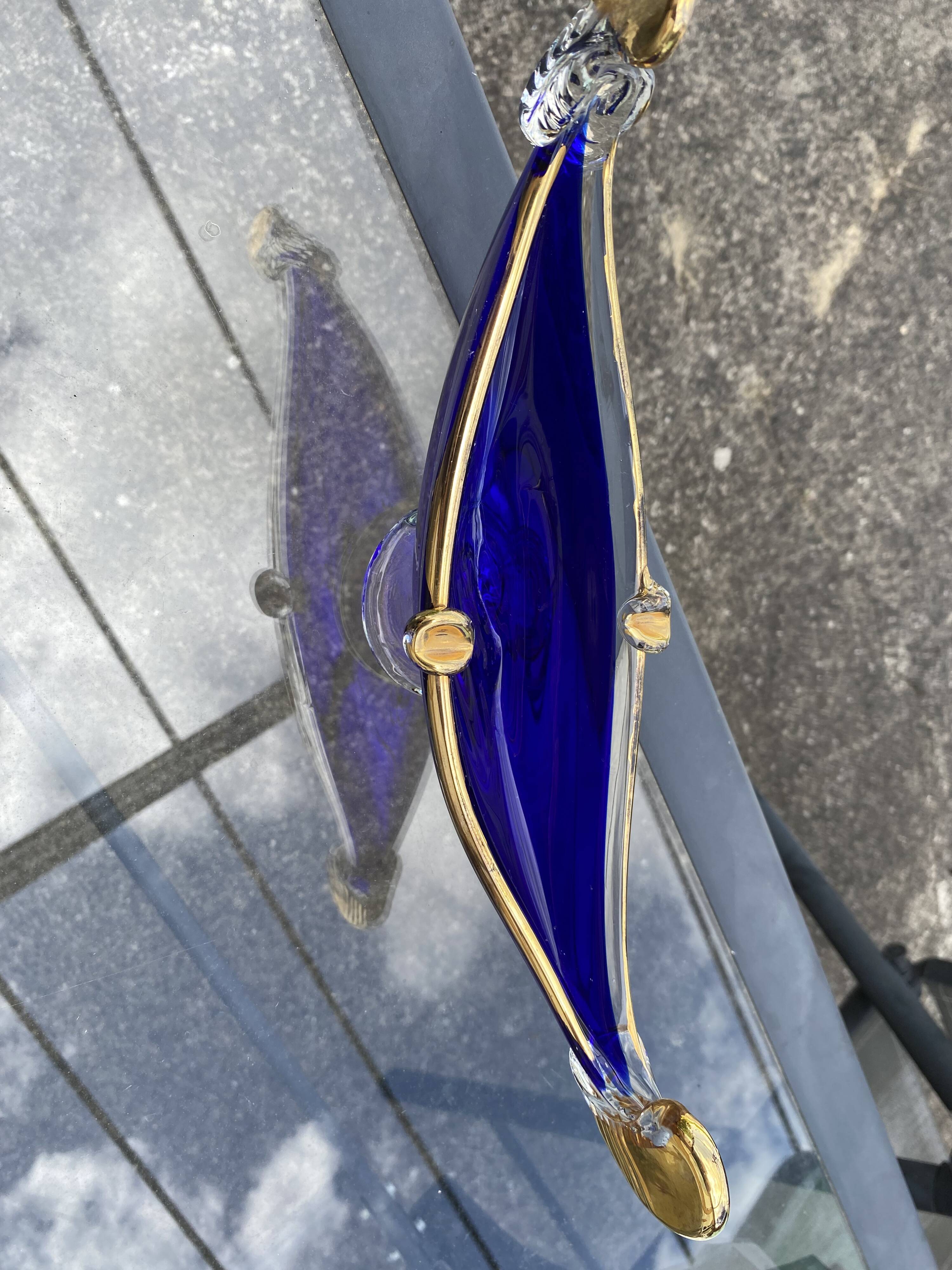 Vintage cobalt blue Murano glass gondola bowl with gilding.