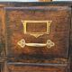 Workshop furniture made of oak and brass.
