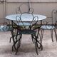Old wrought iron garden furniture, 2 armchairs, 2 chairs and the table