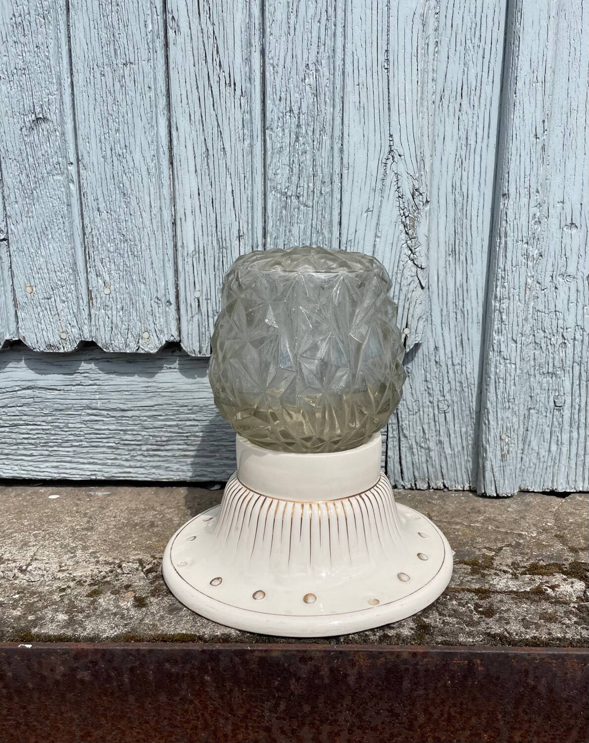 Art Deco ceiling light with a porcelain base.