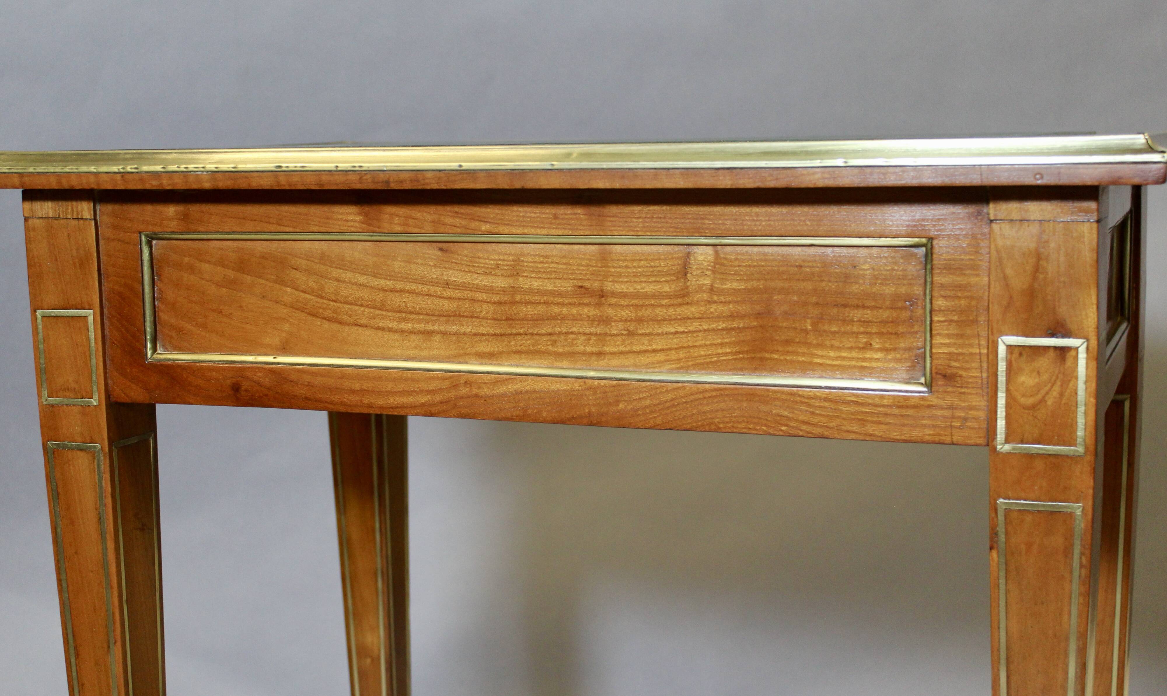 Louis XVI writing table with brass beading
