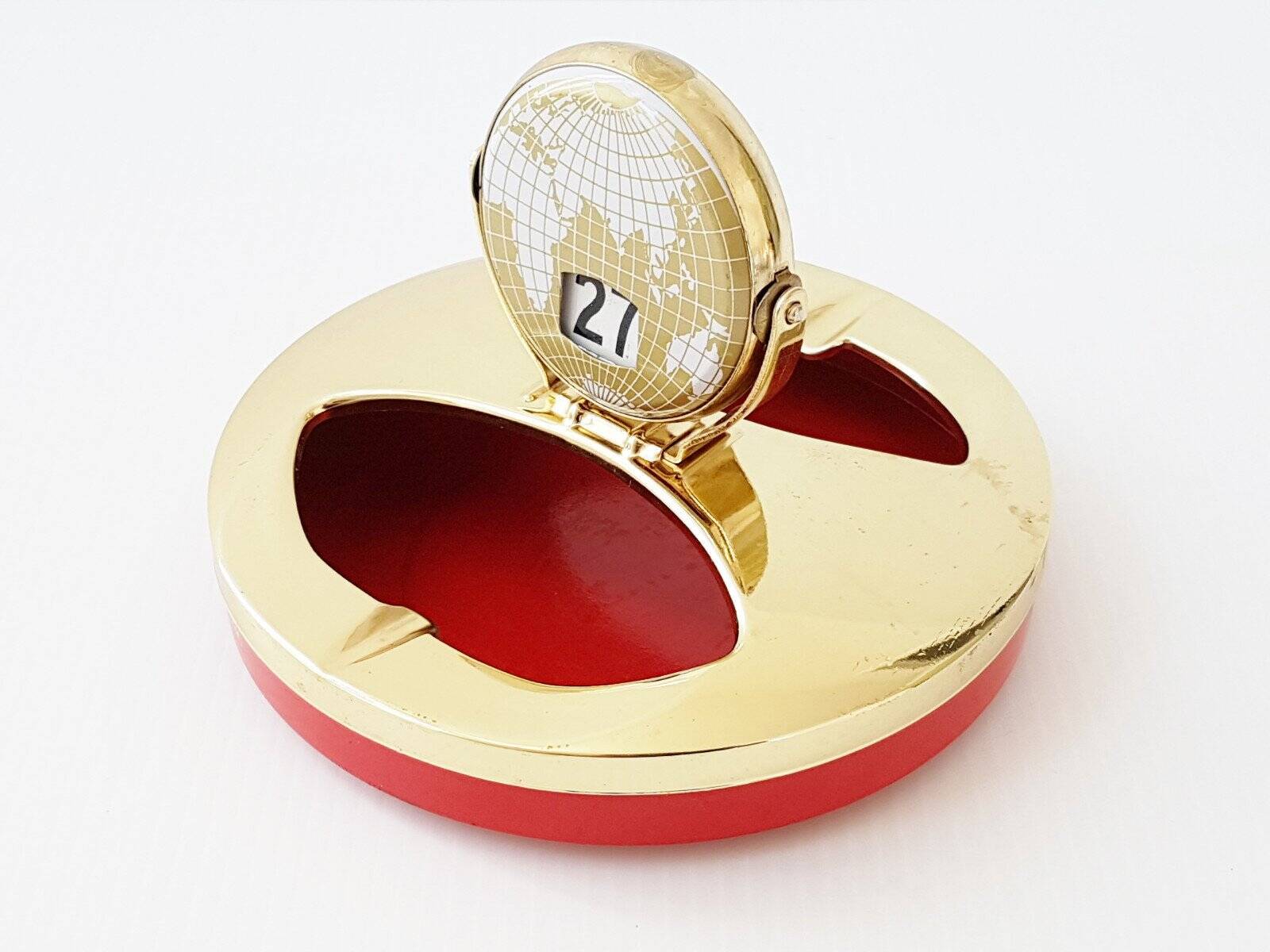 Vintage 1950s brass gold-plated globe perpetual calendar ashtray.