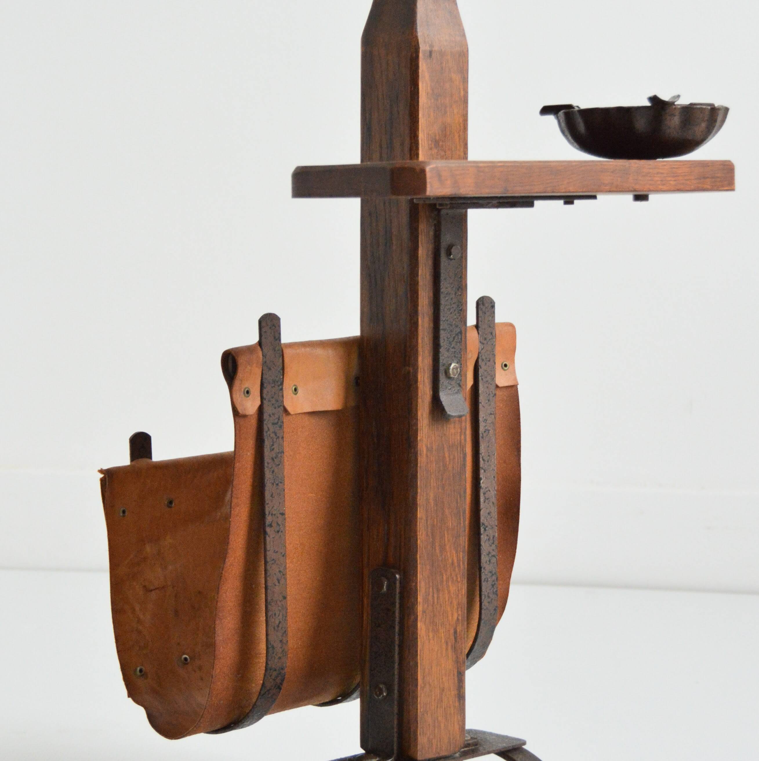 Vintage leather magazine rack with shelf and brutalist/rustic ashtray.