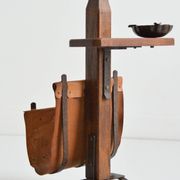 Vintage leather magazine rack with shelf and brutalist/rustic ashtray.