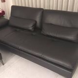 2 black leather sofas roche bobois scenario, one three-seater and one chaise longue.