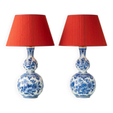 Pair of Royal Delft blue and white ceramic table lamps with new vermilion silk shades.