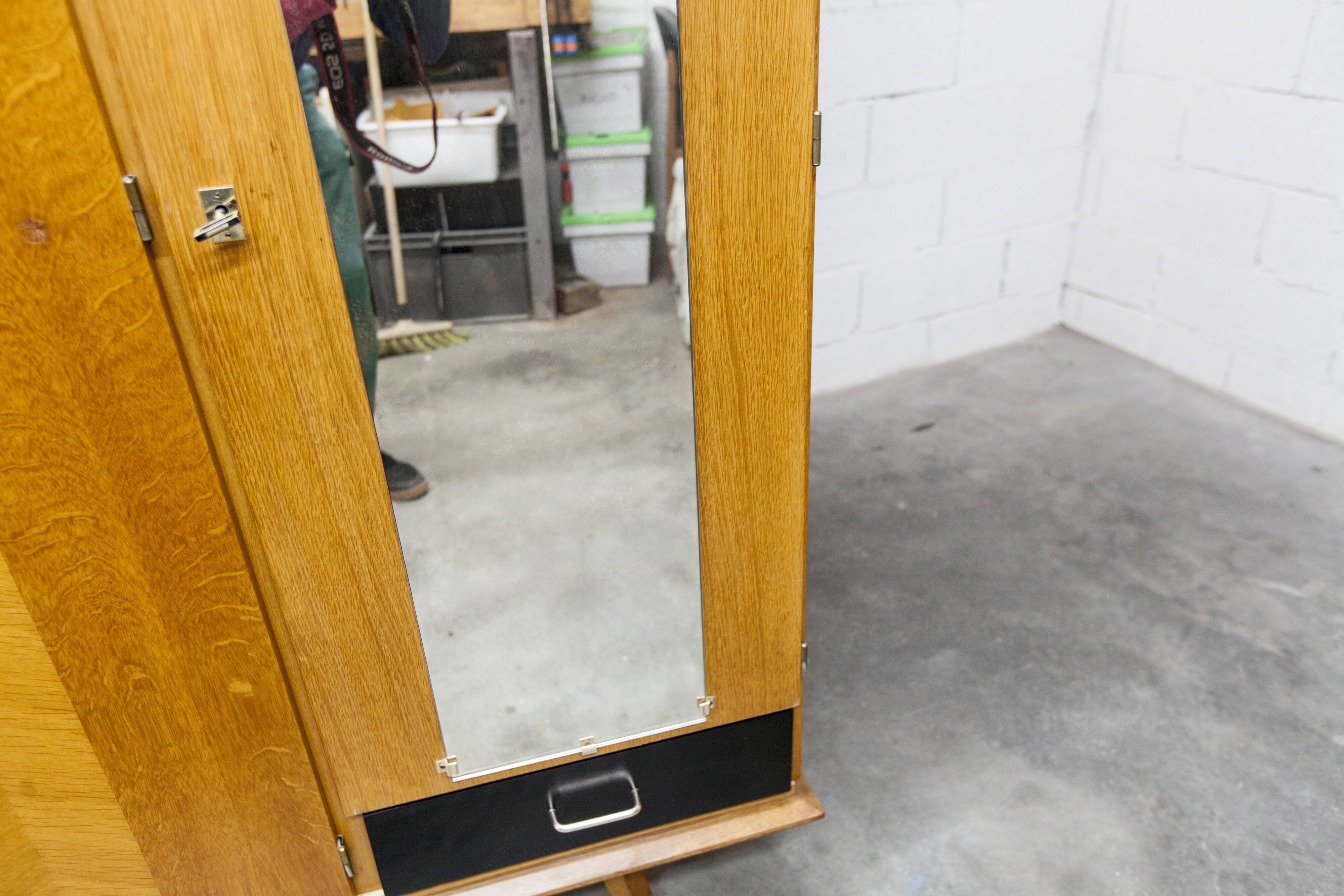 French wardrobe with tapered legs, 3 doors, 1 mirror (27*130), and 1 drawer.