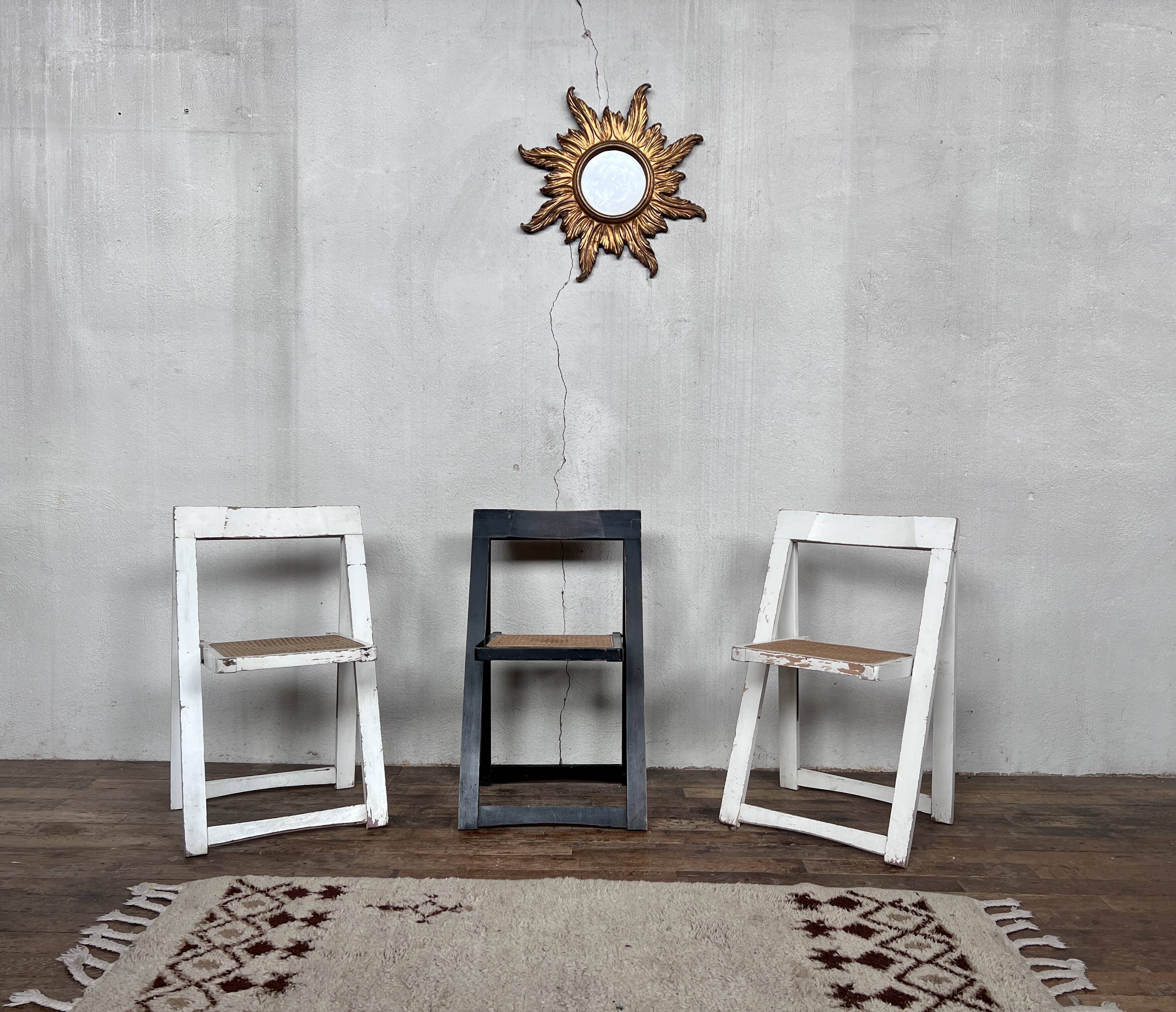 Trio of vintage folding chairs with canning and solid wood