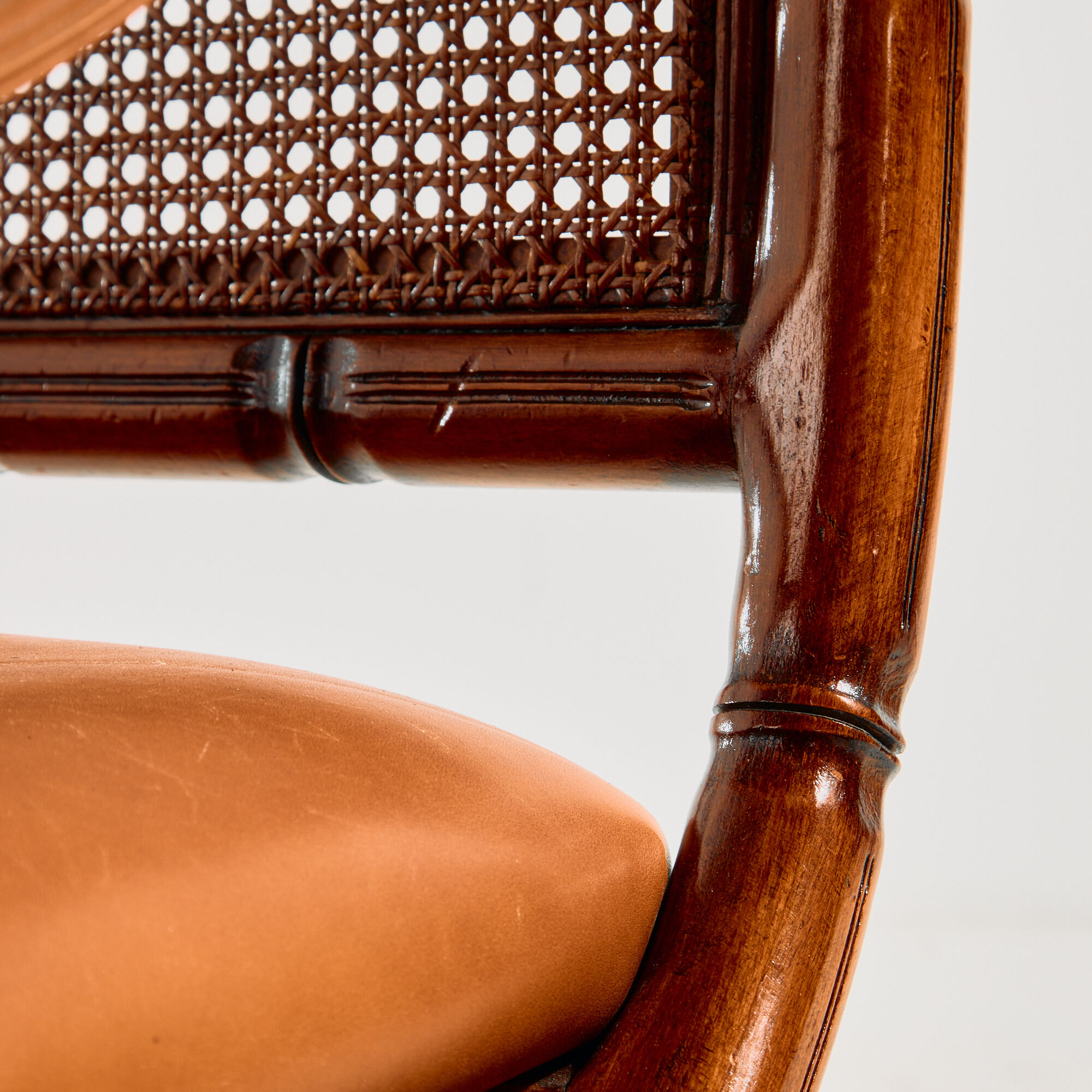 Walnut armchair with bamboo design