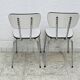 Set of two vintage grey Formica and chrome chairs.