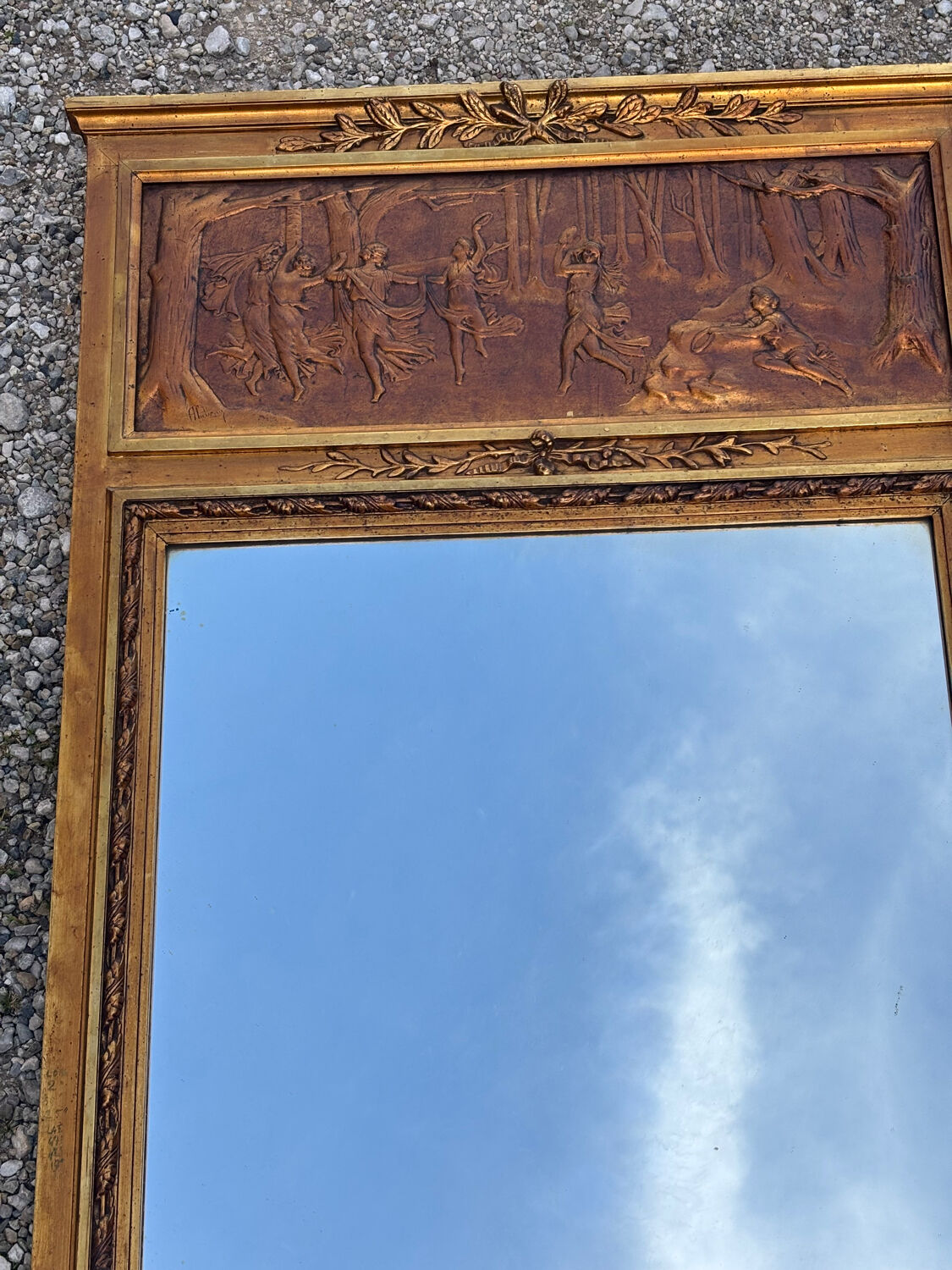 Golden trumeau mirror in Louis XVI style, 20th century.