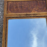 Golden trumeau mirror in Louis XVI style, 20th century.