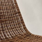 Chair design in rattan, woven wicker and chrome wire metal.