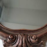 Pretty Baroque style mirror / Louis XV patinated with pink / golden copper reflections. Volutes, leafy shells