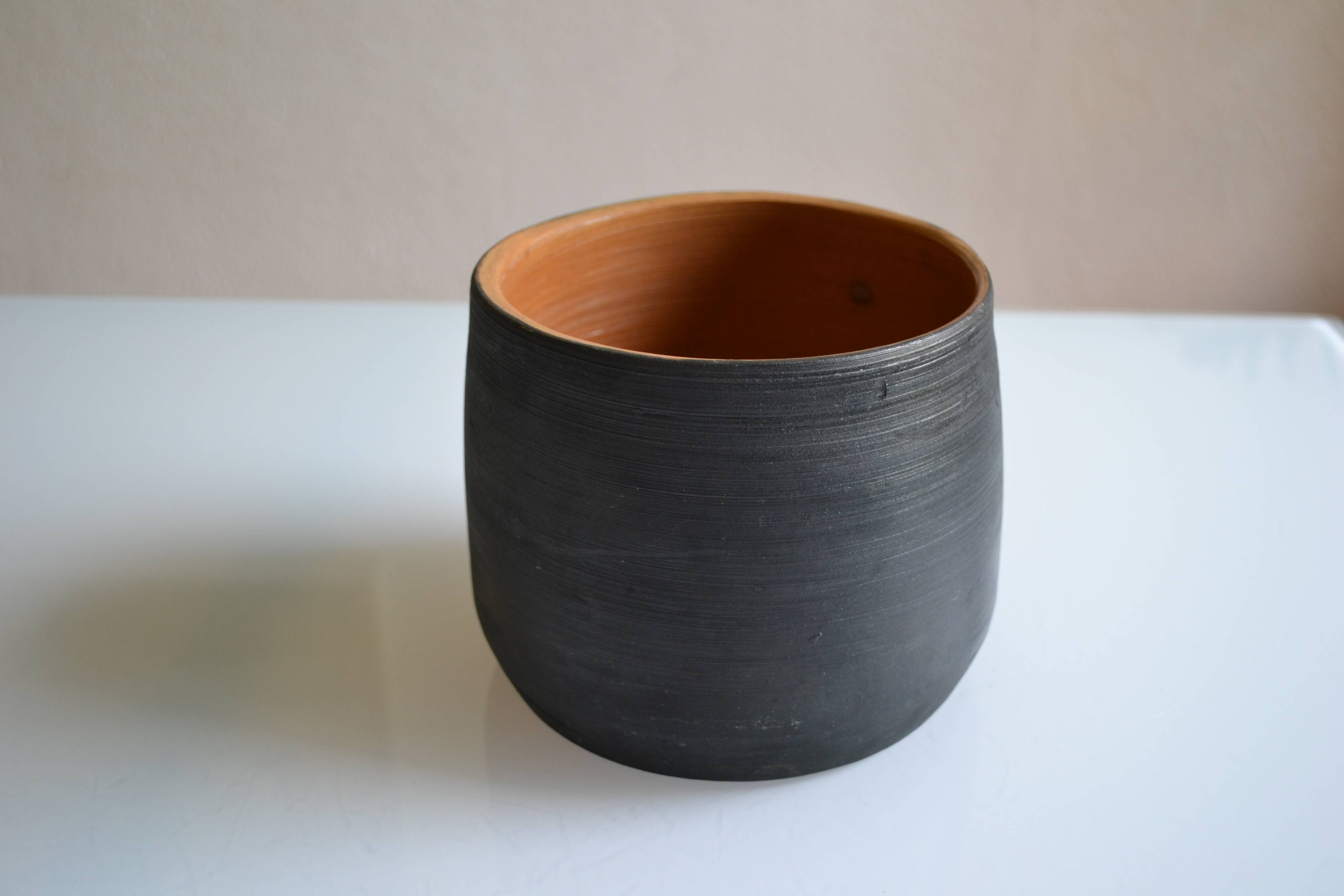 Ceramic cache pot or pocket emptying dish with a signature fish to identify.