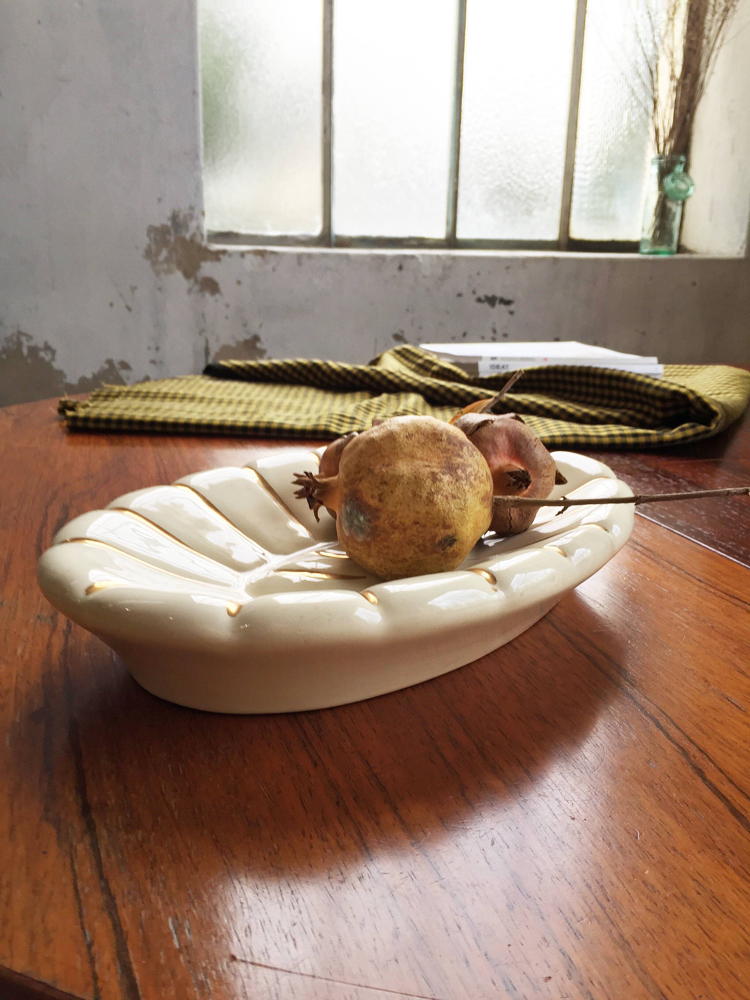 White and gold ceramic plate