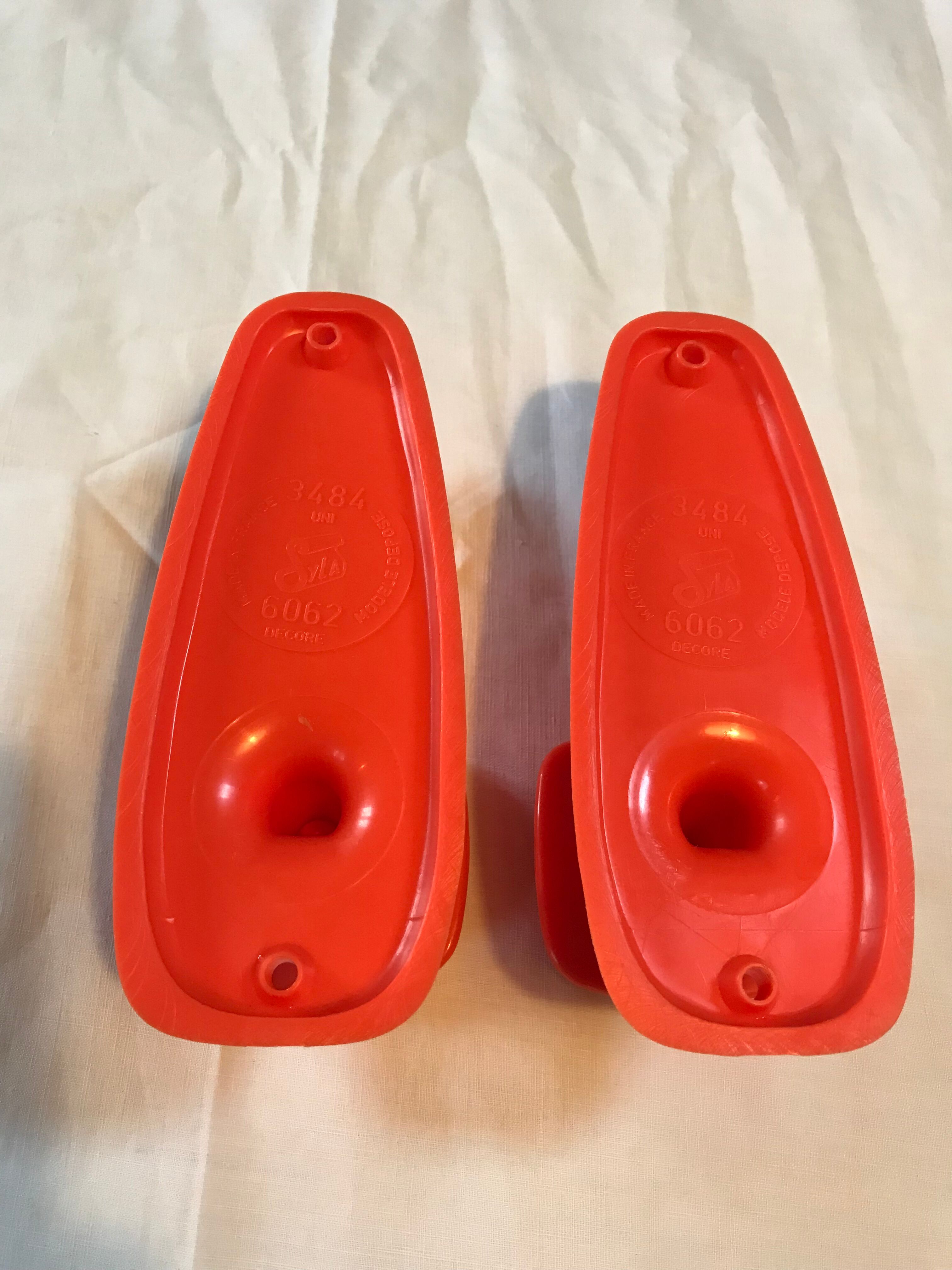 2 orange plastic hooks 70s.