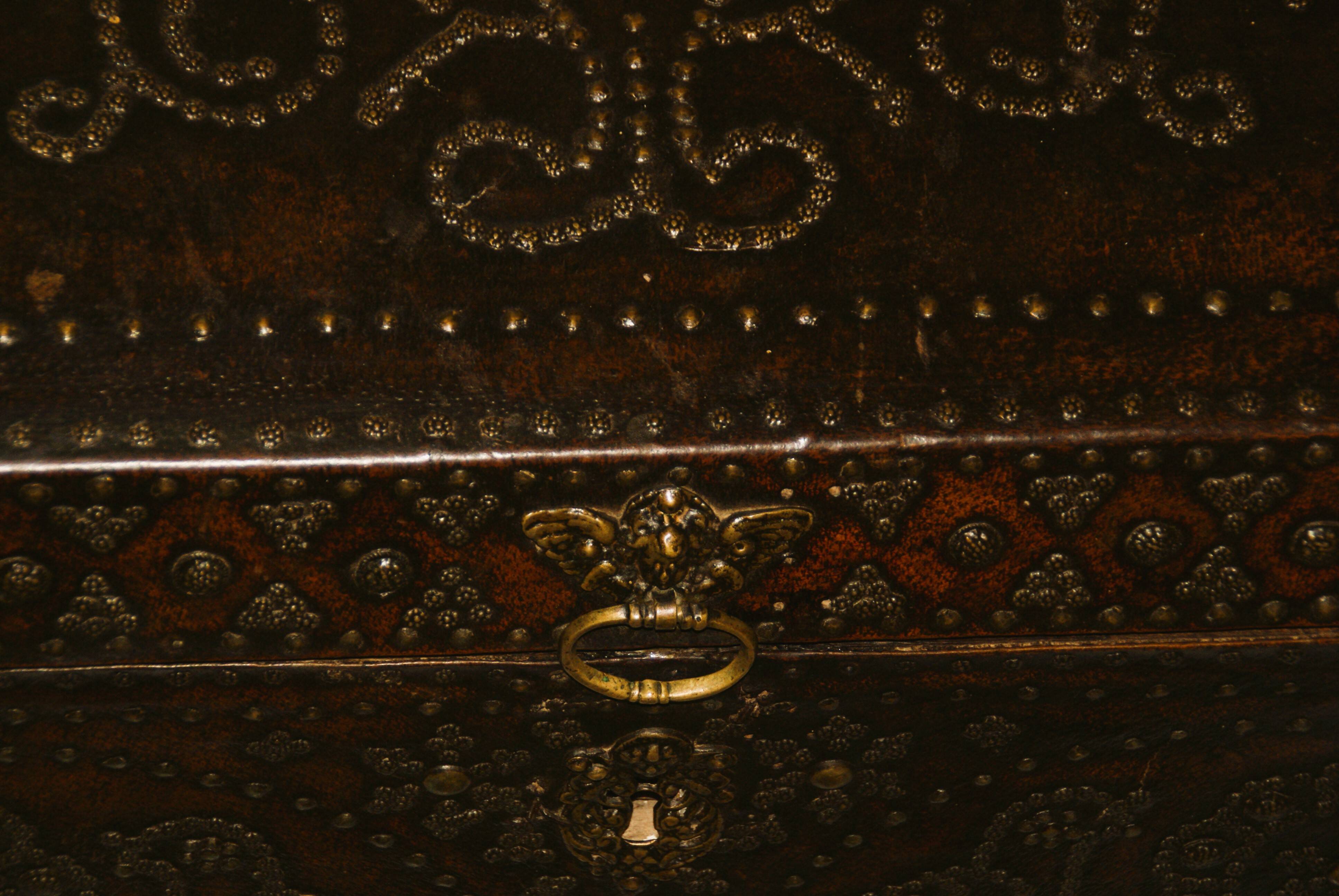 17th century studded leather travel trunk, richly decorated