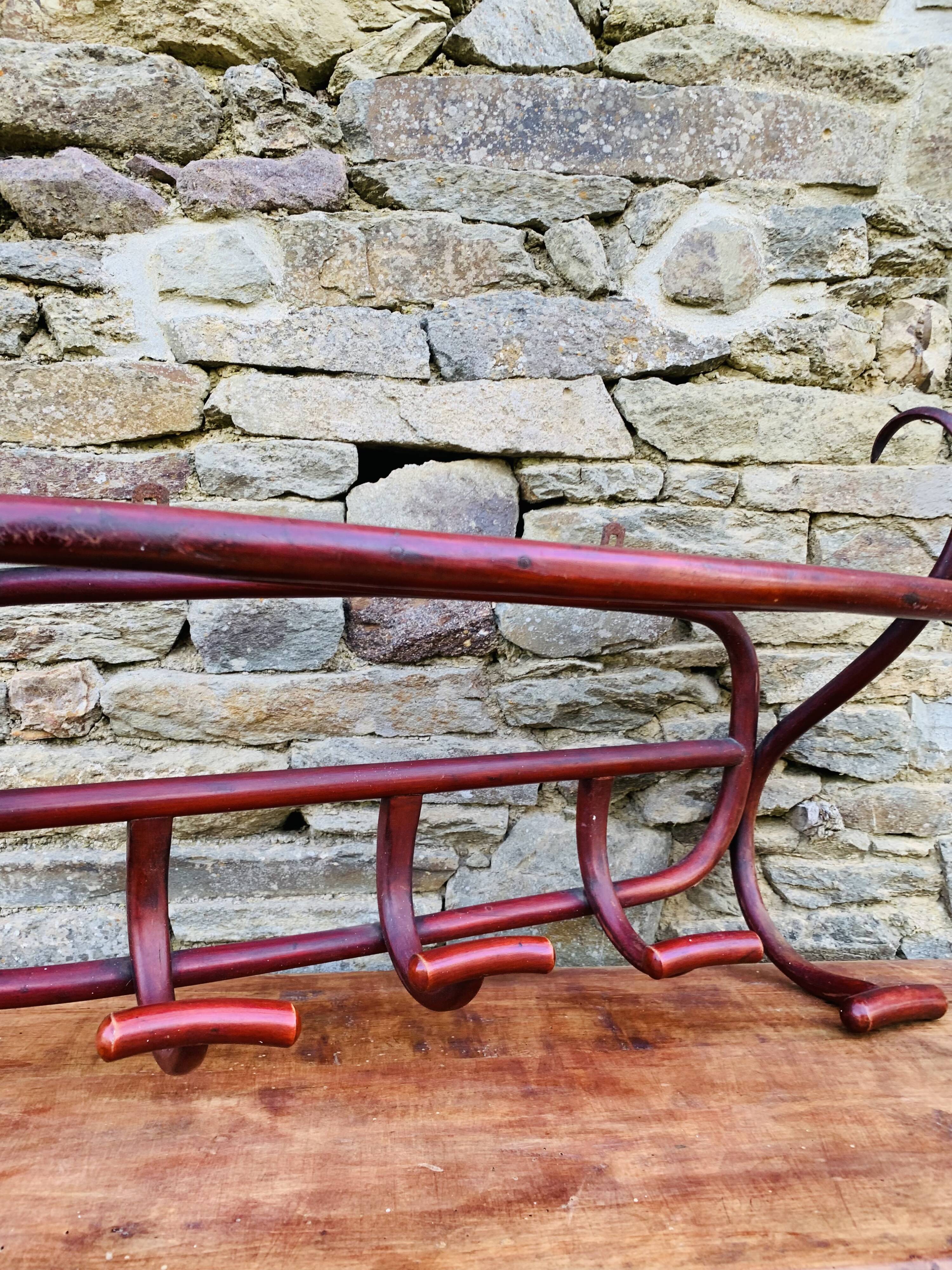 Antique curved wooden wall coat rack