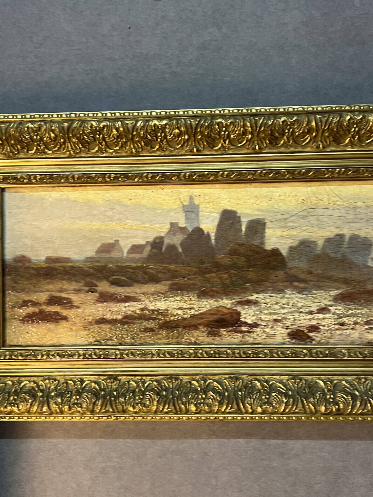 A. Laemmermann, oil painting on cardboard depicting a rocky landscape.
