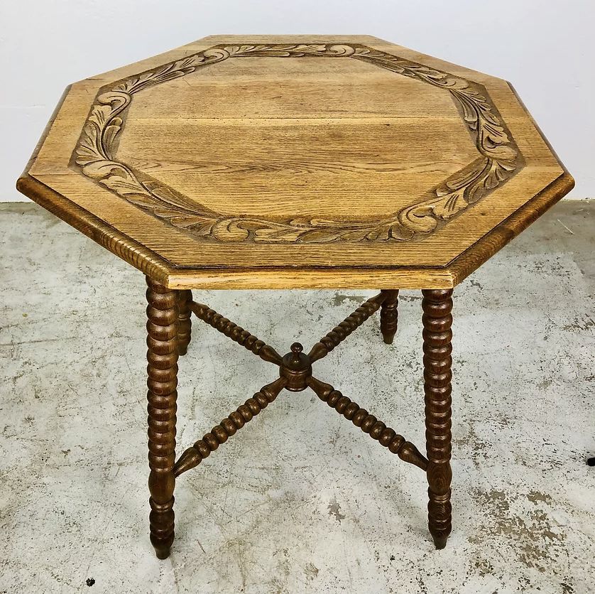 Carved antique wooden table with 8 sides
