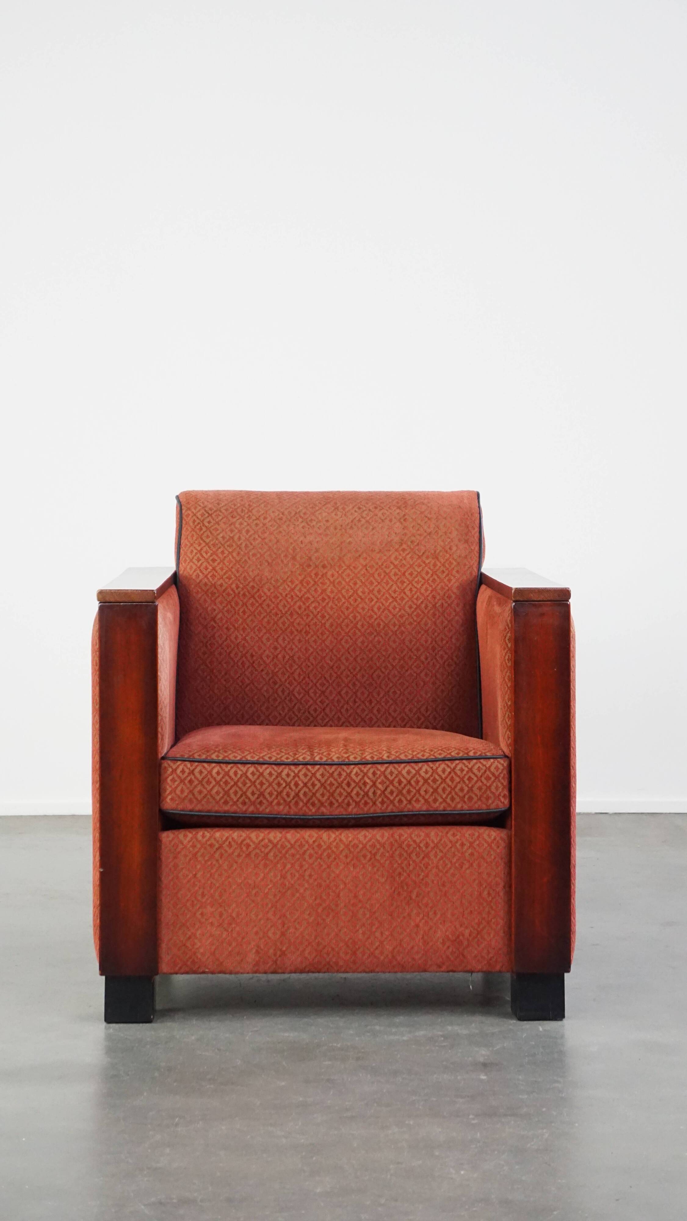 Art Deco design armchair with red fabric upholstery and wooden details