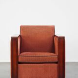 Art Deco design armchair with red fabric upholstery and wooden details