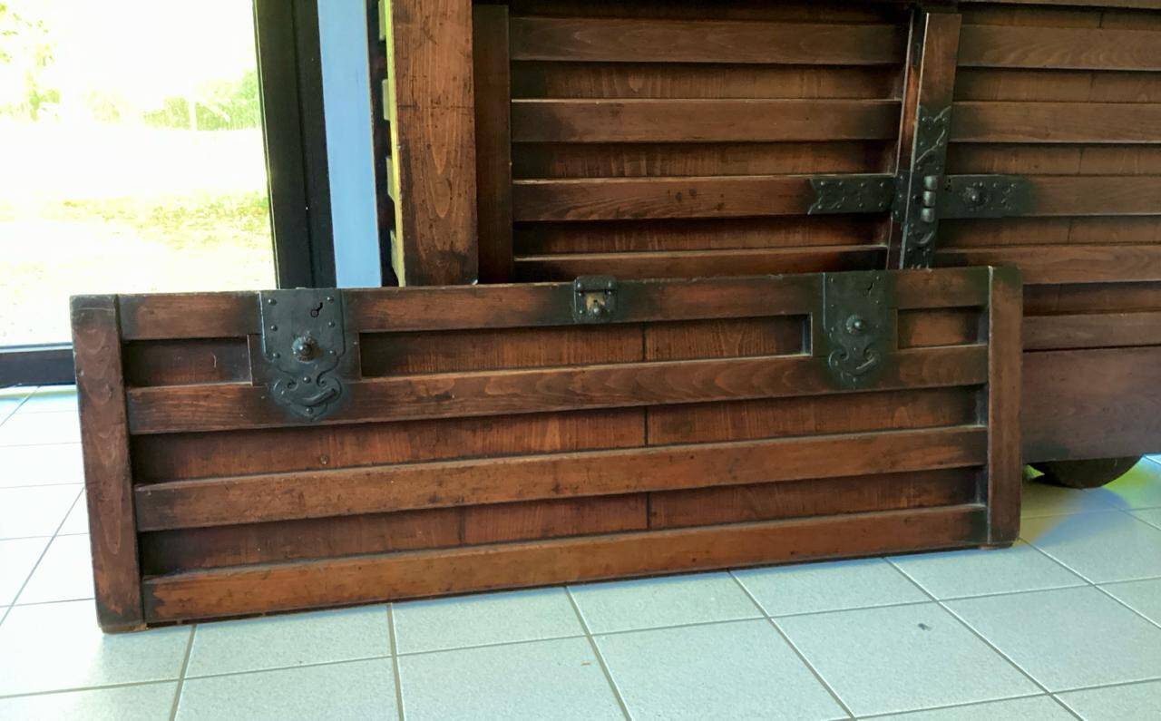 Japanese antique wooden chest with black fittings.
