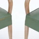 Pair of bridge chairs in cerus wood and green leather