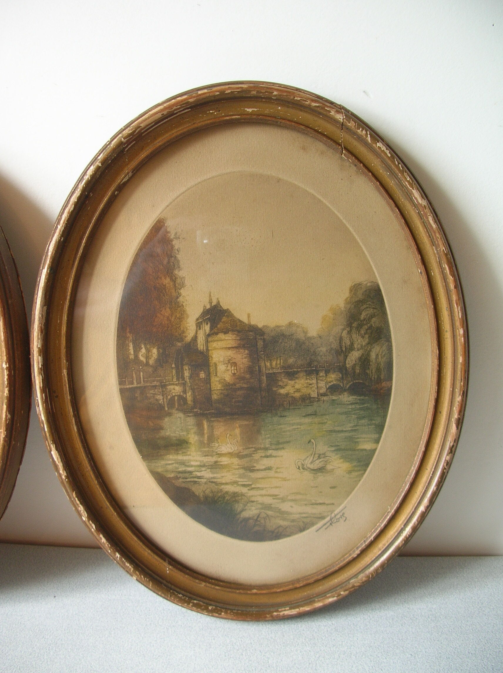 Old pair of lithographs house at the edge of the water signed wooden medallion frame