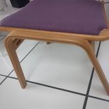 Relaxing armchair and its Scandinavian footrest