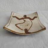 Two terracotta bowls with ethnic decoration and vintage signature.