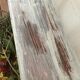Wooden footrest in his white patina