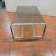 Coffee table with stainless steel base and smoked glass, from the 70s