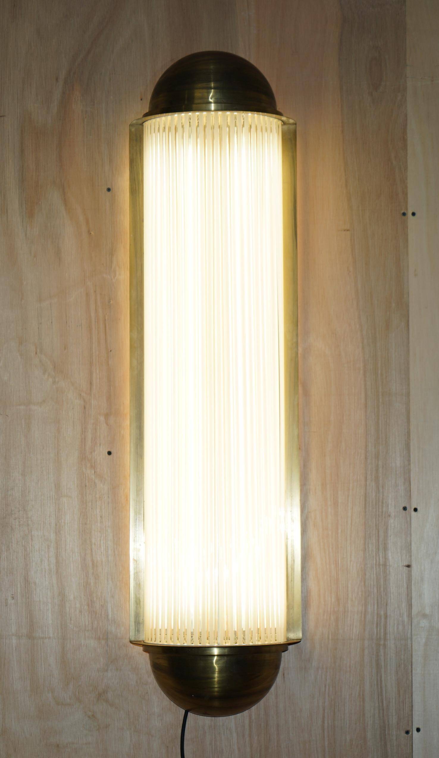Pair of Art Deco wall sconces in brass and glass by Genet-Michon.