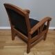 Fauteuil colonial en teck et cuir noir