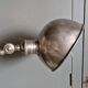 Old adjustable industrial lamp in bronze with 2 arms.