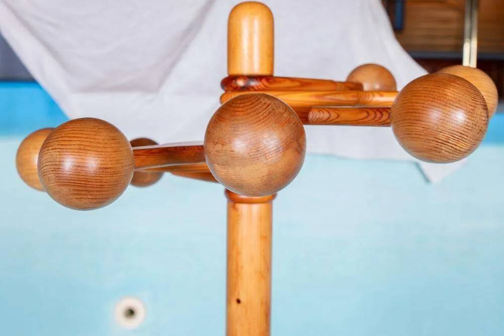 Minimalist organic coat rack in pine from the 1970s in space age style.