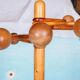 Minimalist organic coat rack in pine from the 1970s in space age style.
