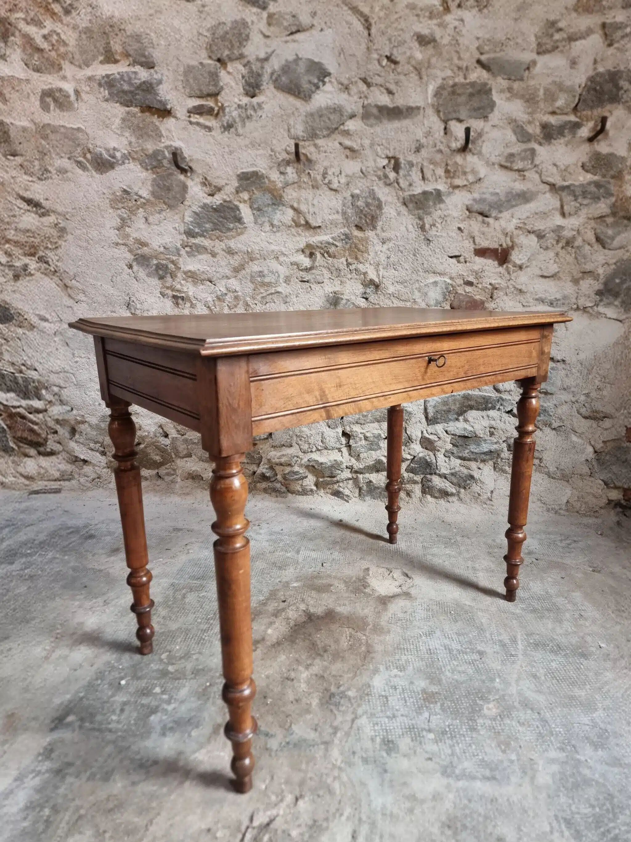 Antique French writing table in walnut with a drawer, circa 1900.