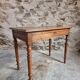 Antique French writing table in walnut with a drawer, circa 1900.