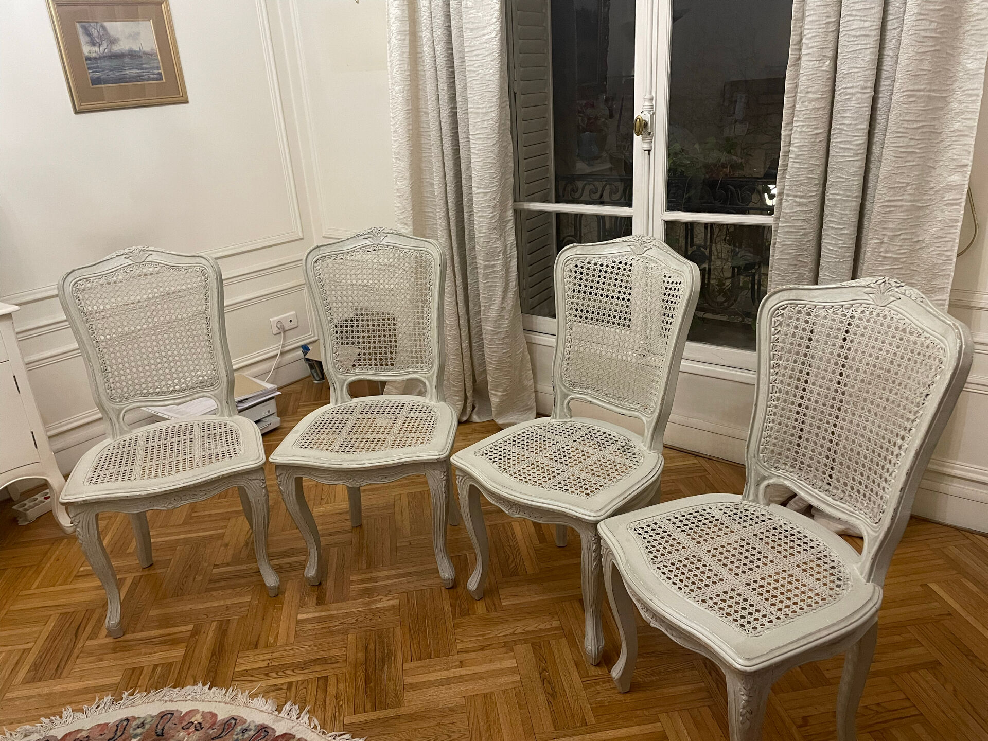 Set of 4 white caned chairs in Louis XV style.